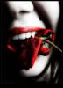Vampire holding rose in her teeth